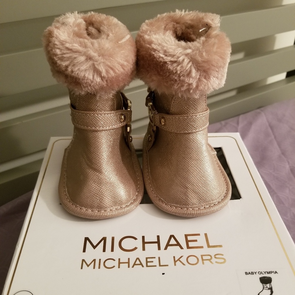 Pink Michael Kors baby boots.
